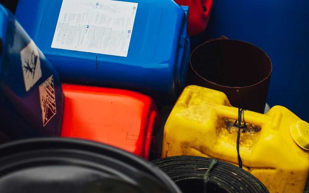 Various types of hazardous waste containers in different colors
